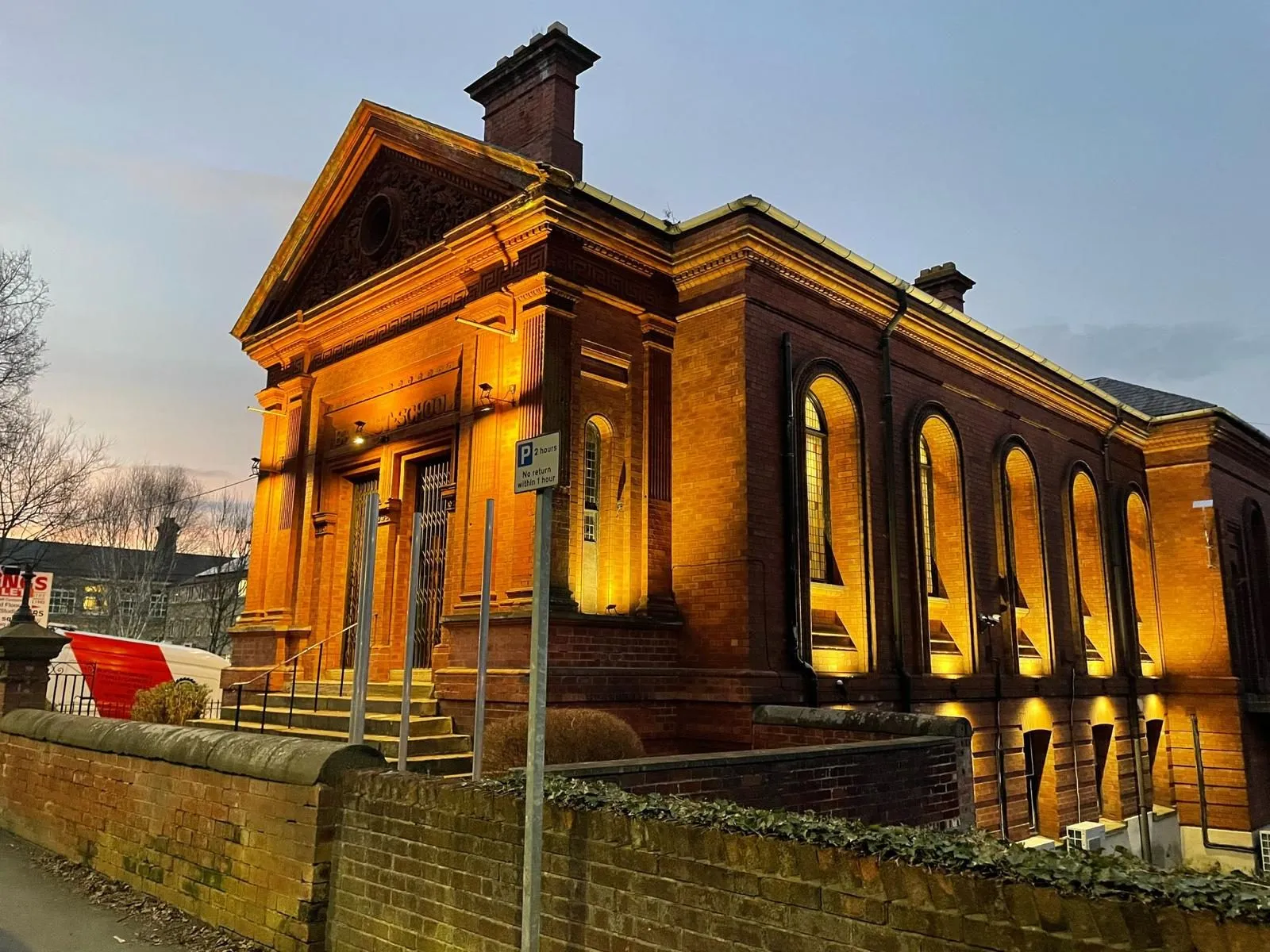 Chapel House Business Centre, a former Baptist church on Meanwood Road, Leeds, lit up at dusk